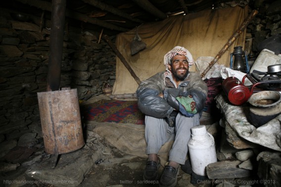 A Gujjar from the village Daksum, working as a security guard of the snow clearing machine for BEACON, a leg of the Indian Army in his makeshift tent at Sinthan Top in Kashmir.